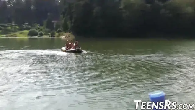 Group of naughty teens is having fun while swimming outdoor