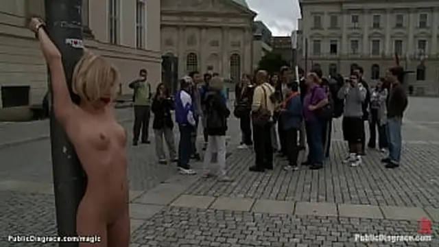 Blonde European hottie Paris Pink is gagged and bound to metal pole in public for onlookers then in stairs fucked by big cock master Tommy