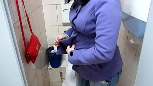 MILF in a public toilet pees, then she changes  Amateur fetish 